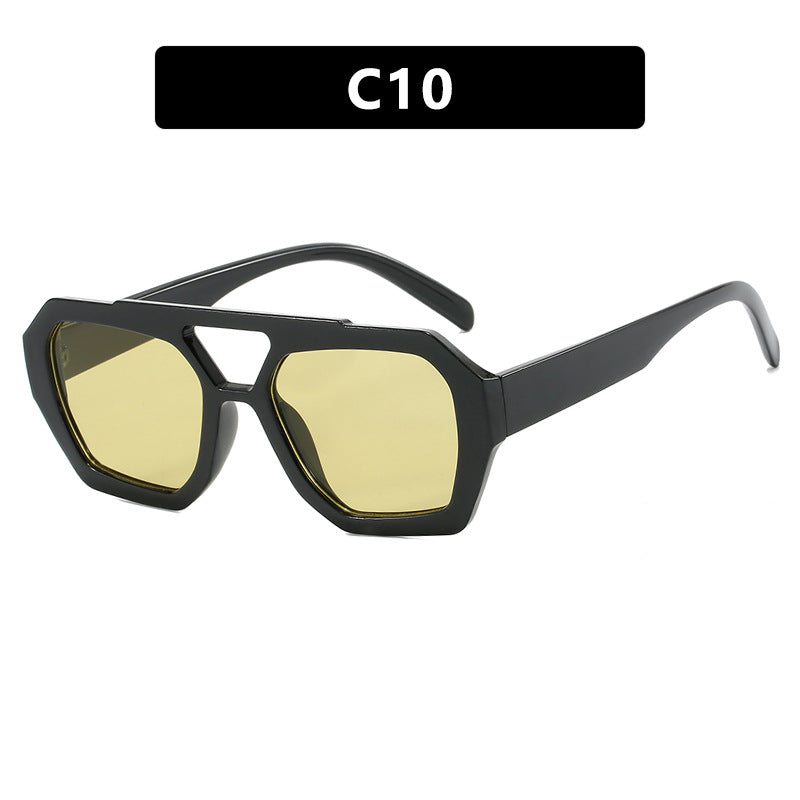 Glossy black oversized sunglasses with green-yellow lenses, supplier style C10.