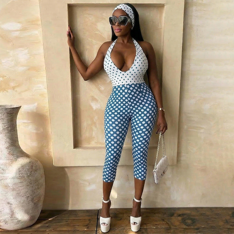 Adult model wearing the blue-and-white polka-dot cropped halter jumpsuit; accessories are styling only.