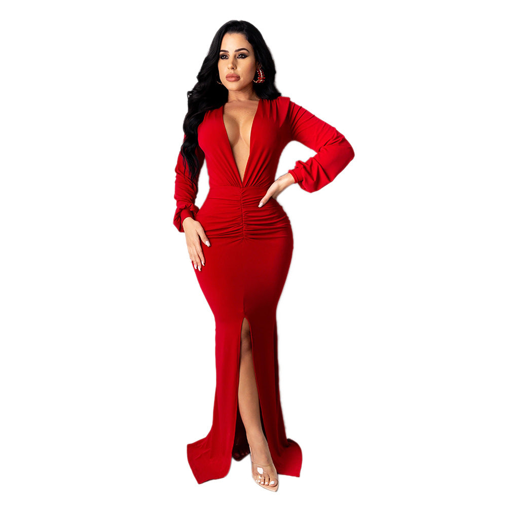 Closer front view of the red Spotlight Status Plunge Maxi Dress showing its deep neckline and gathered waist.