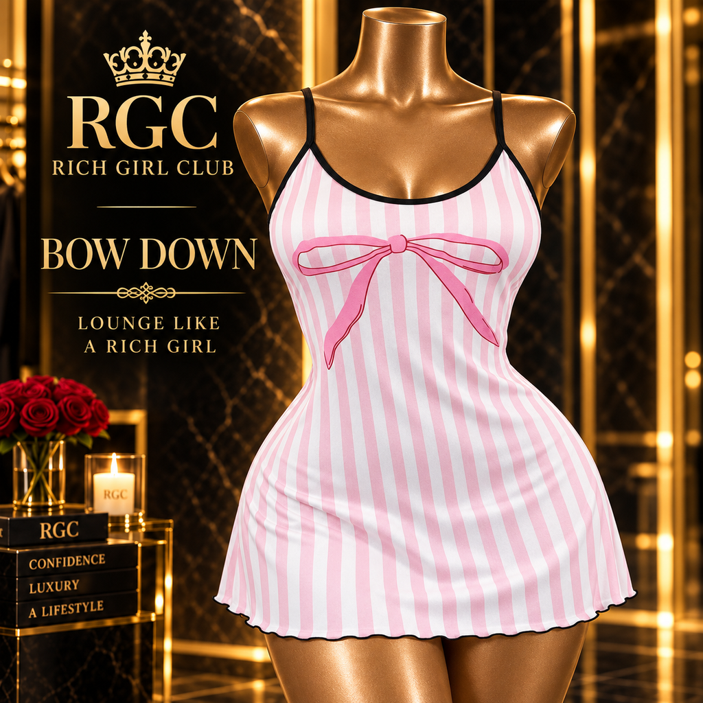 Bow Down pink-and-white striped mini dress front detail showing the bow, black trim, and flared hem