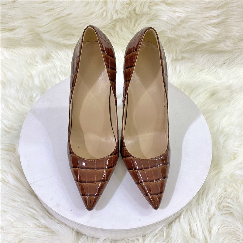 Brown embossed pointed stiletto pumps front view