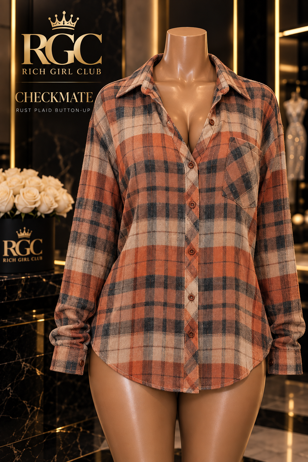 Checkmate rust plaid long-sleeve button-up shirt on a bronze RGC mannequin, showing pointed collar, chest pocket, buttons, cuffs, and curved hem.