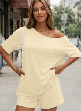 Apricot Shoulder Kiss tee and shorts set on an adult model outdoors.