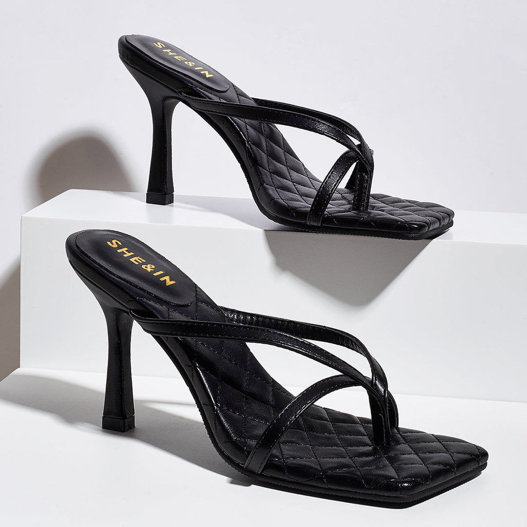 Black square-toe sculpted strap mule heels shown as a pair