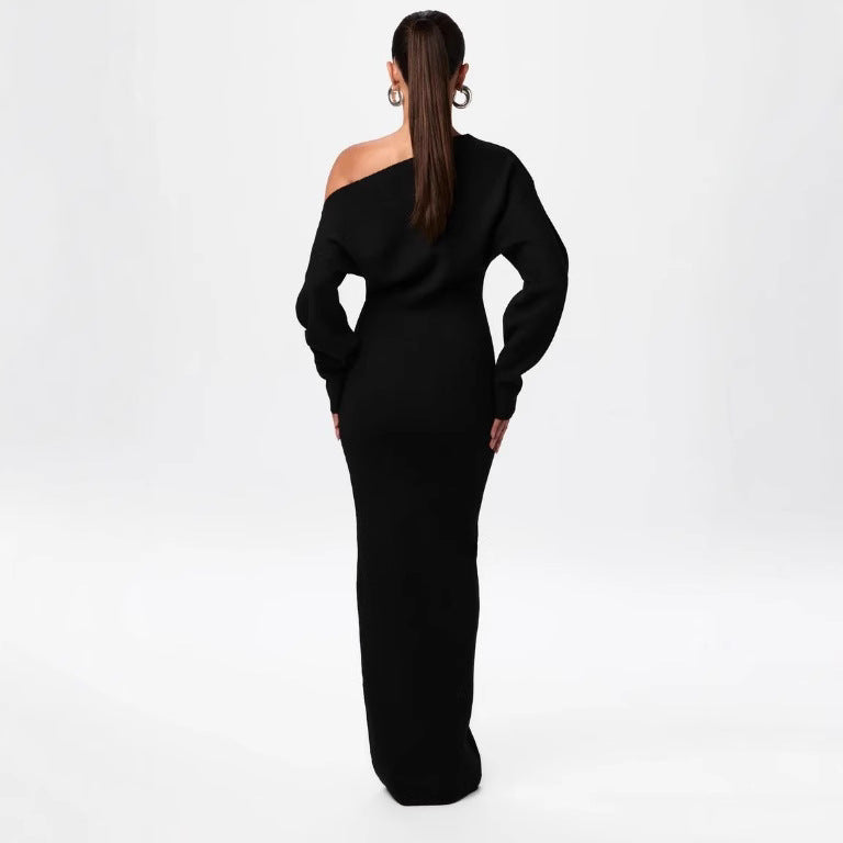 Adult model wearing the black Shoulder Kiss Column Dress, back view.