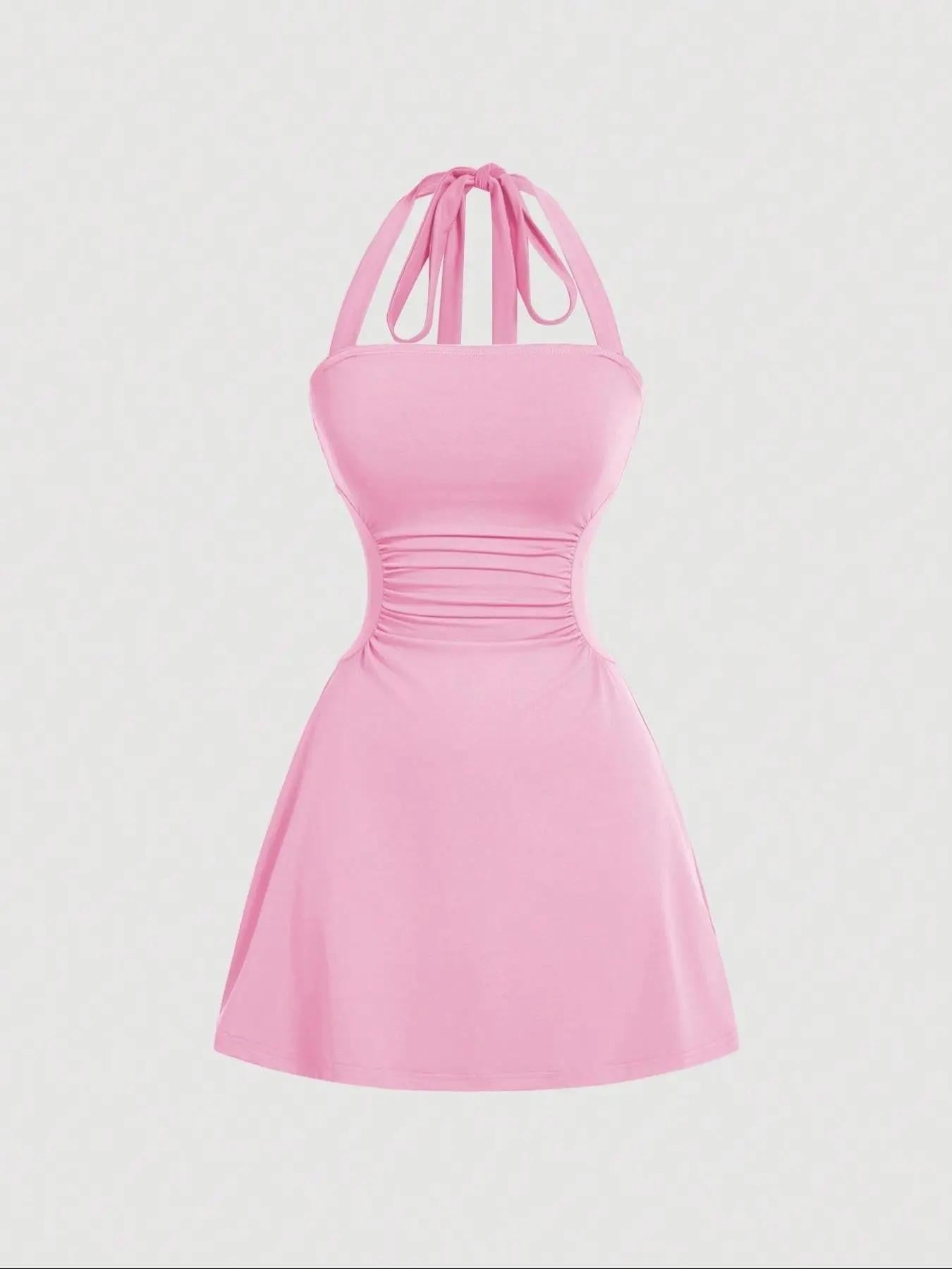 Solid bright-pink A-line mini dress with ruched waist and tie-back halter straps, front product view.
