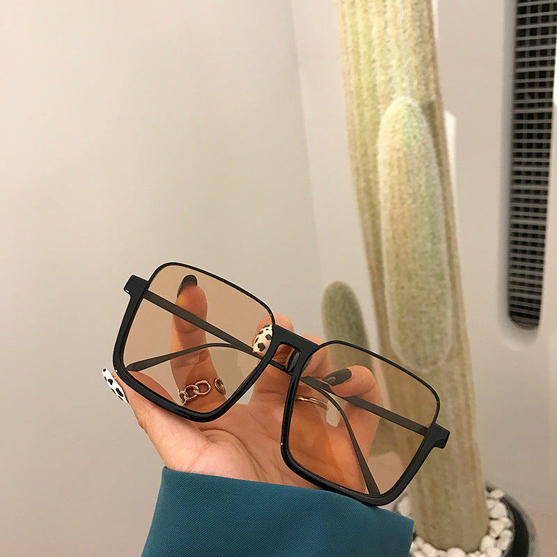 Midnight Muse black square sunglasses on a white background