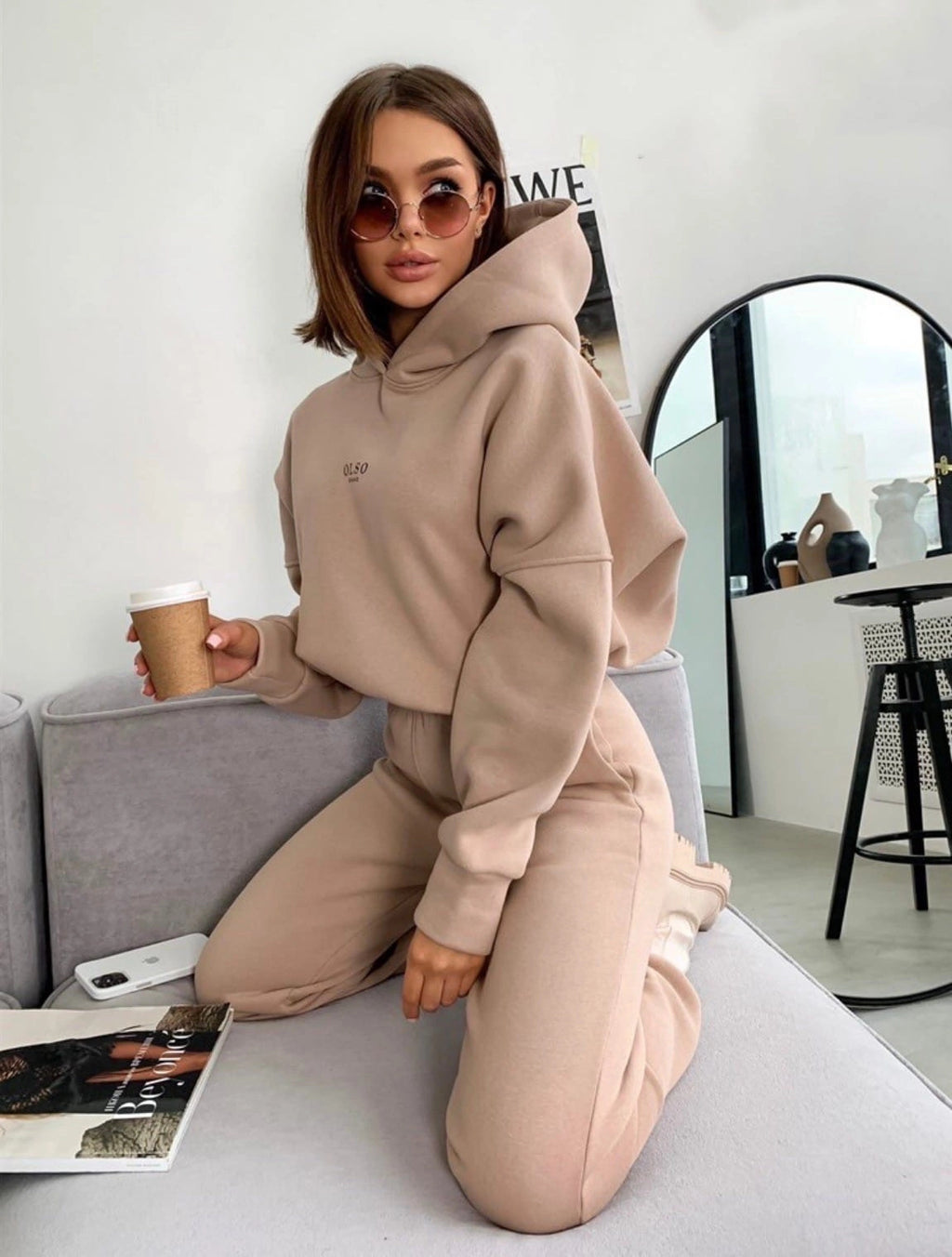 Dark khaki Soft Life hoodie and jogger set seated side view