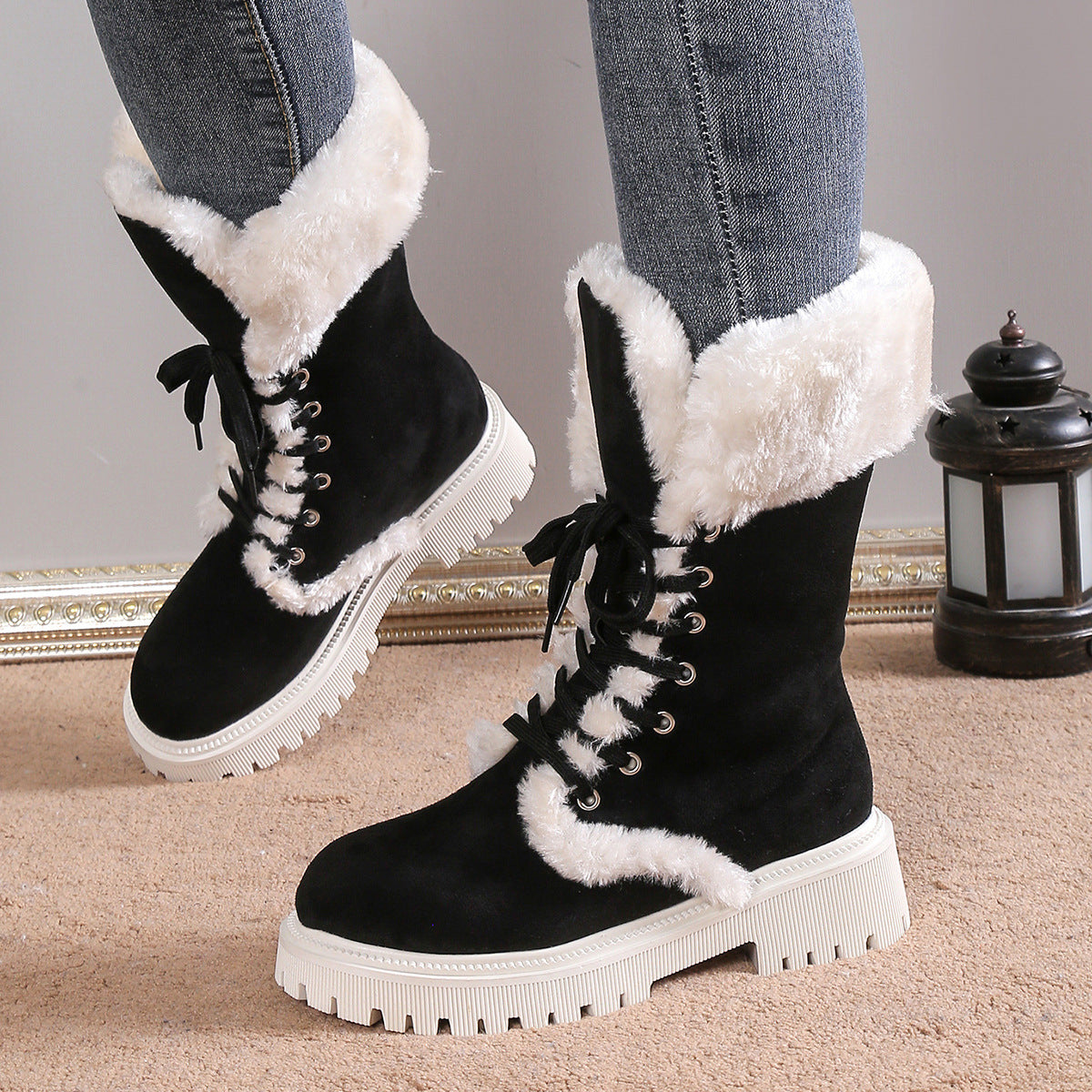 Adult model wearing black Frost Kiss Lace-Up Boots, close front view.