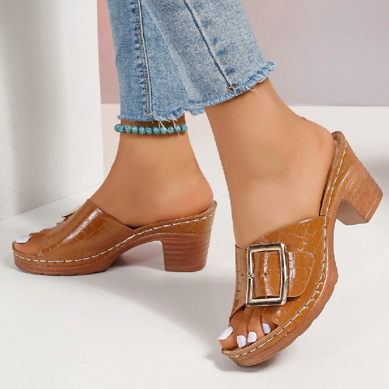 Orange croc-textured buckle slides shown from the side and front.
