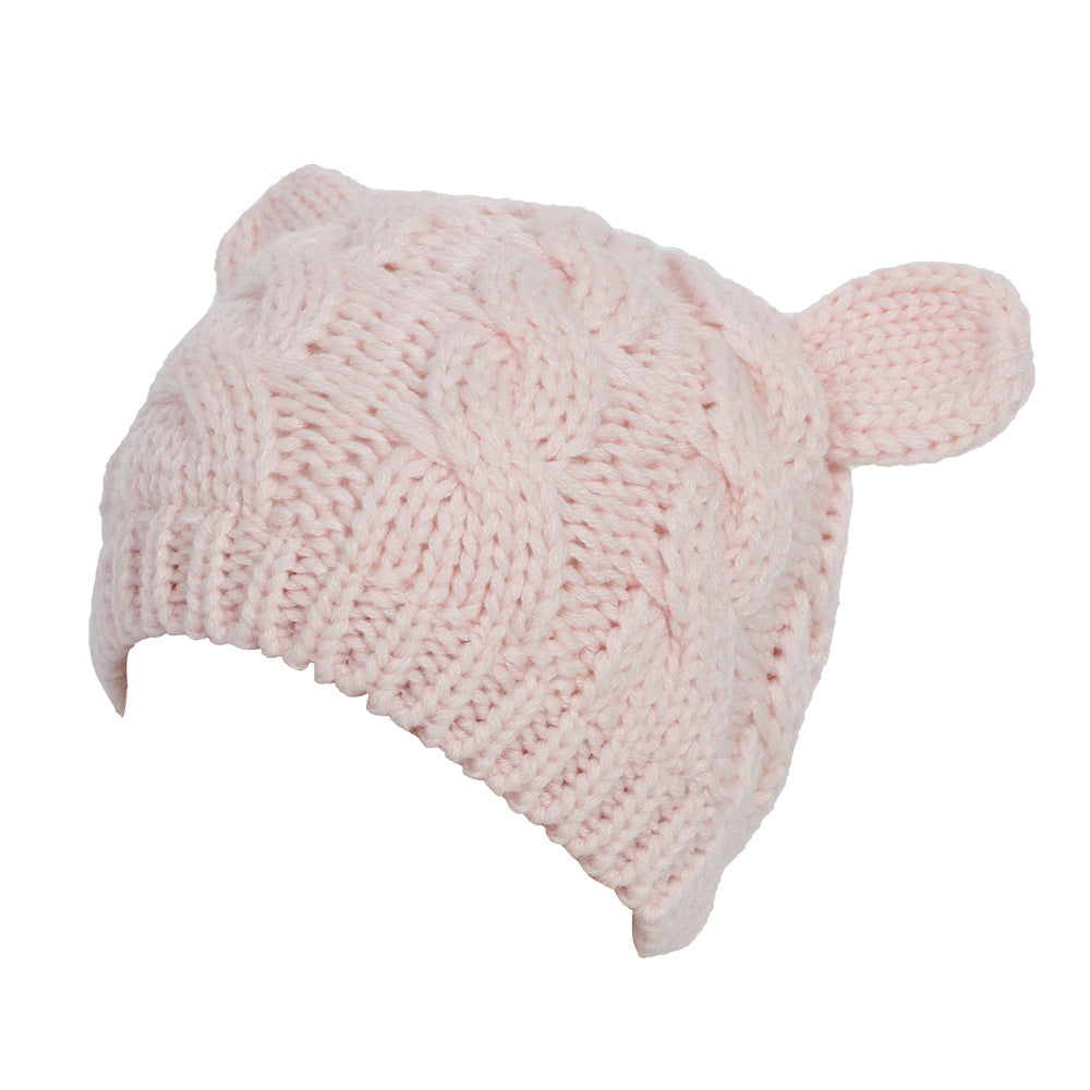 Kitty Club pink cat-ear cable-knit beanie on a model