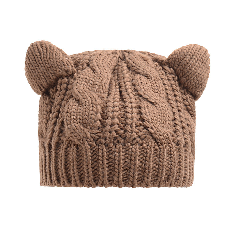 Kitty Club khaki cat-ear cable-knit beanie on a model