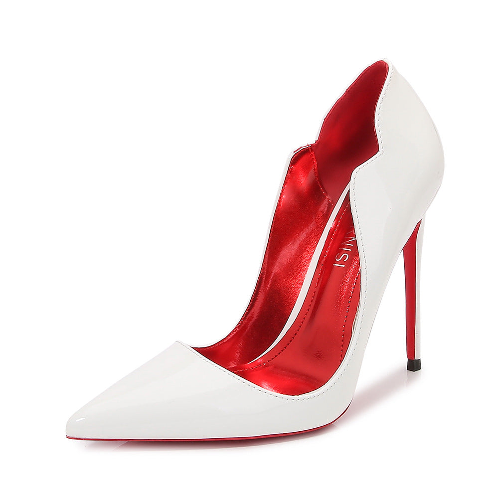 White glossy Scarlet Sole Authority Pump in three-quarter view with pointed toe, sculpted side opening and red interior