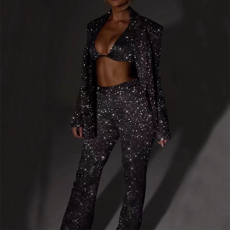 Adult model wearing the black sequin bra, matching tailored jacket, and trousers set, front view.