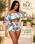 RGC campaign hero with an adult model wearing the Garden Party Ruffle Set in a white multicolor botanical print.