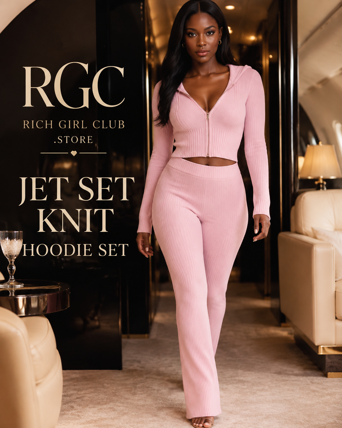 Jet Set Knit Hoodie Set in blush pink on an adult model in a private aviation lounge, showing the fitted zip-front hooded knit top and matching high-waist trousers.