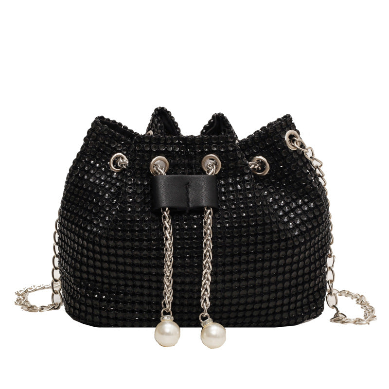 Main Character Rhinestone Clutch Black supplier detail with black rhinestone surface, round handle, drawstring tassels, and chain strap