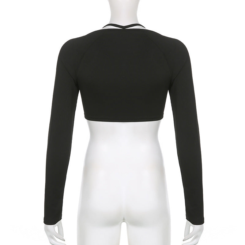 Back view of black long-sleeve crop top on mannequin