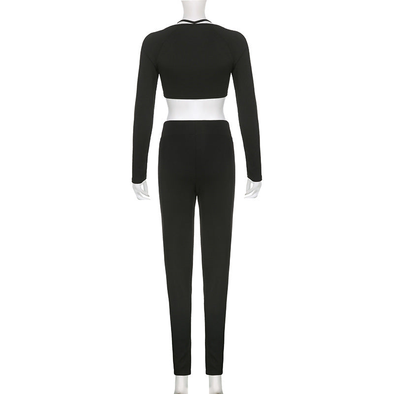 Black crop top and matching pants on mannequin, full back view