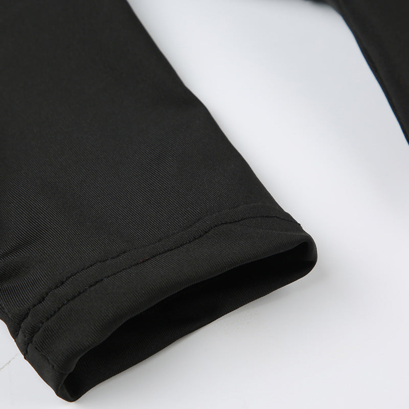 Close-up of black sleeve cuff and seam construction