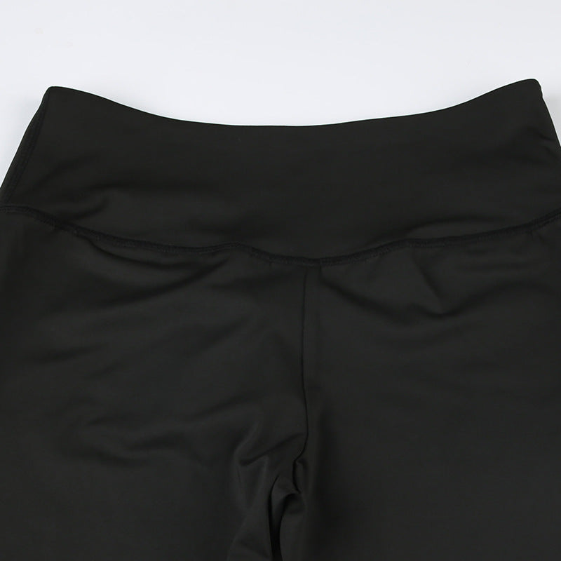 Close-up of black pants waistband and center-front seam