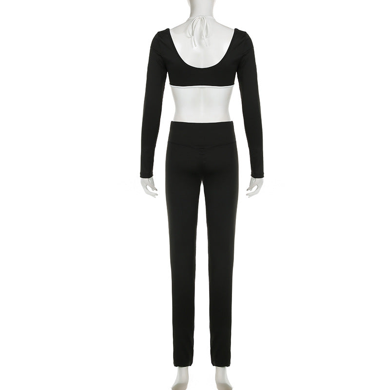 Black crop top and long pants on mannequin, full back view