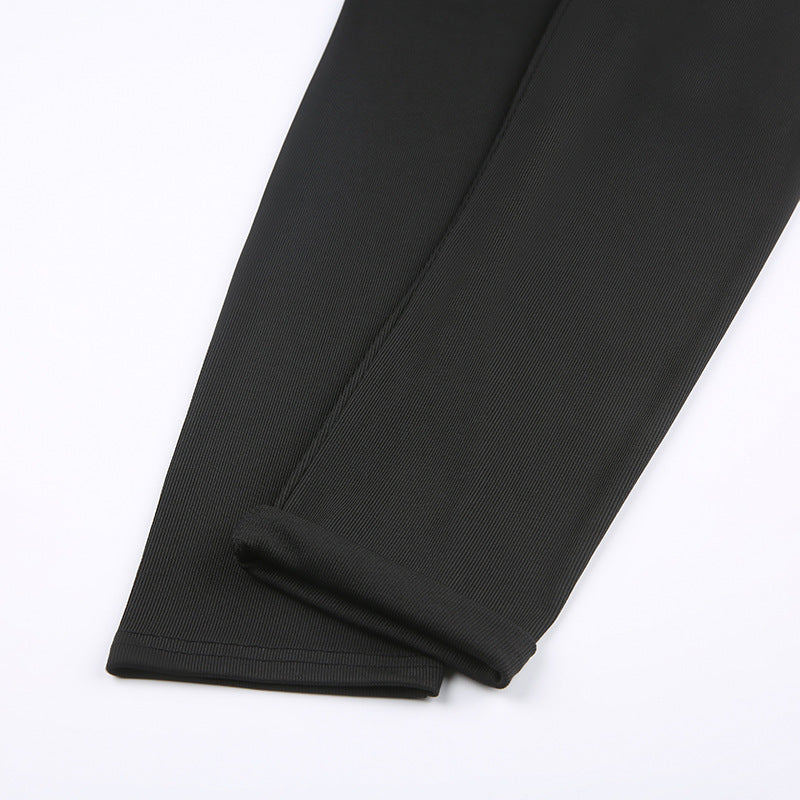 Close-up of black pants hems and rib-knit texture