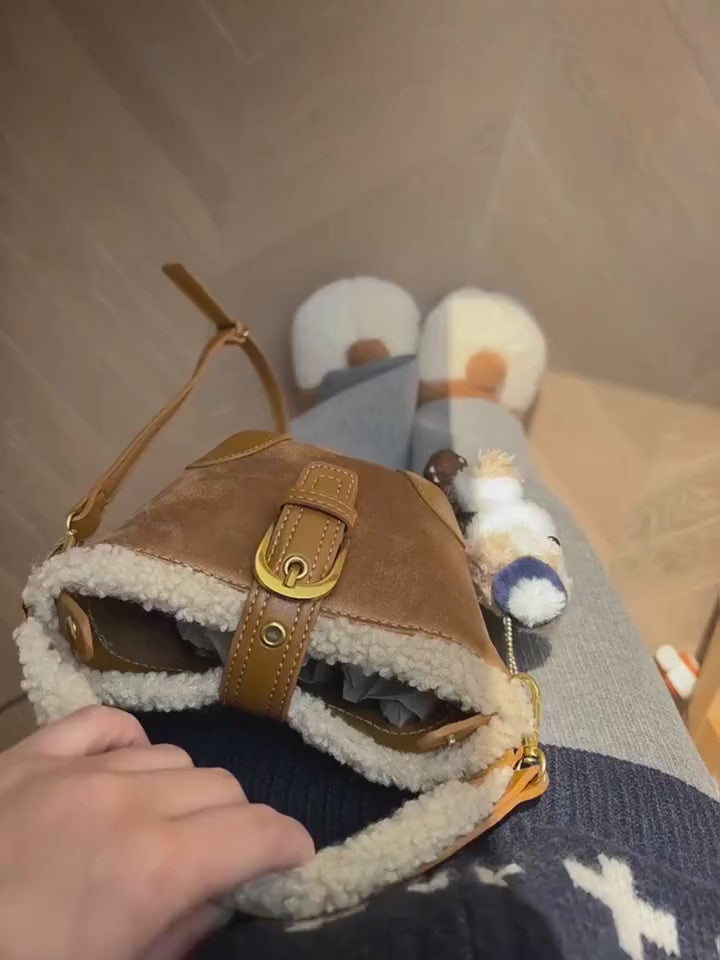 Close-view video of the Plush Agenda Mini Messenger Bag.