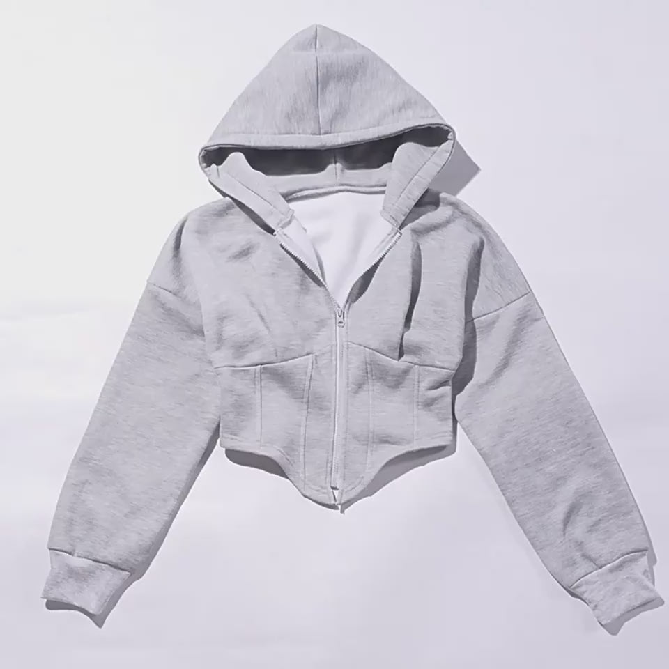 Video showing the Main Character Corset Zip Hoodie in motion with its hood, zipper, and pointed hem.