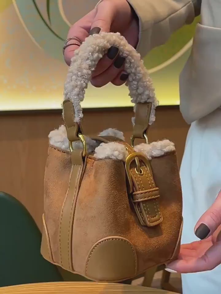 Video showing additional views of the Plush Agenda Mini Messenger Bag and shoulder strap.