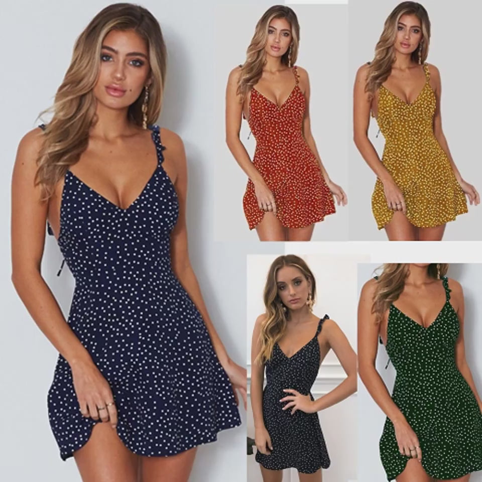 Adult model showing a dotted V-neck sundress in motion.