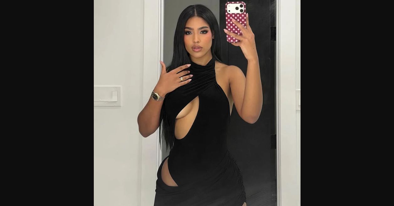 Redline Asymmetric Cutout Mini Dress in black, styled front view