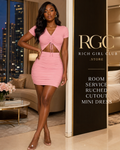 Room Service Ruched Cutout Mini Dress in pink on an adult model in a luxury penthouse, showing short sleeves, ruched tie front, waist cutout, and fitted mini skirt.