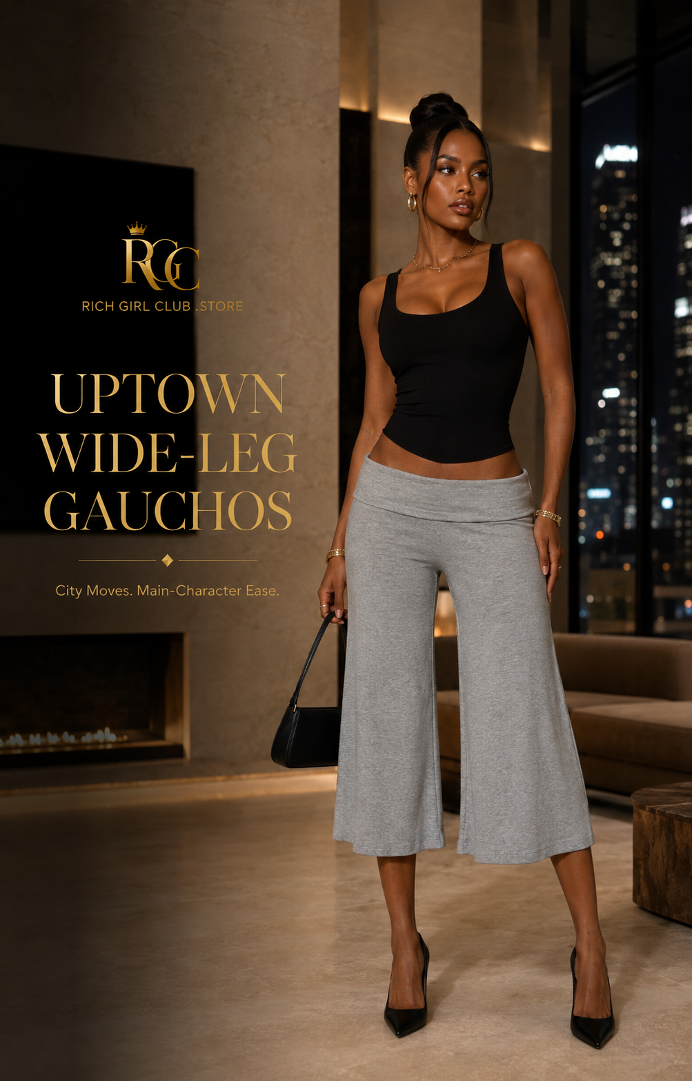 Adult Black model wearing solid heather-gray Uptown Wide-Leg Gauchos with a wide fold-over waistband and cropped draped legs in a luxury RGC city campaign